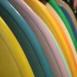 row of colorful surfboards